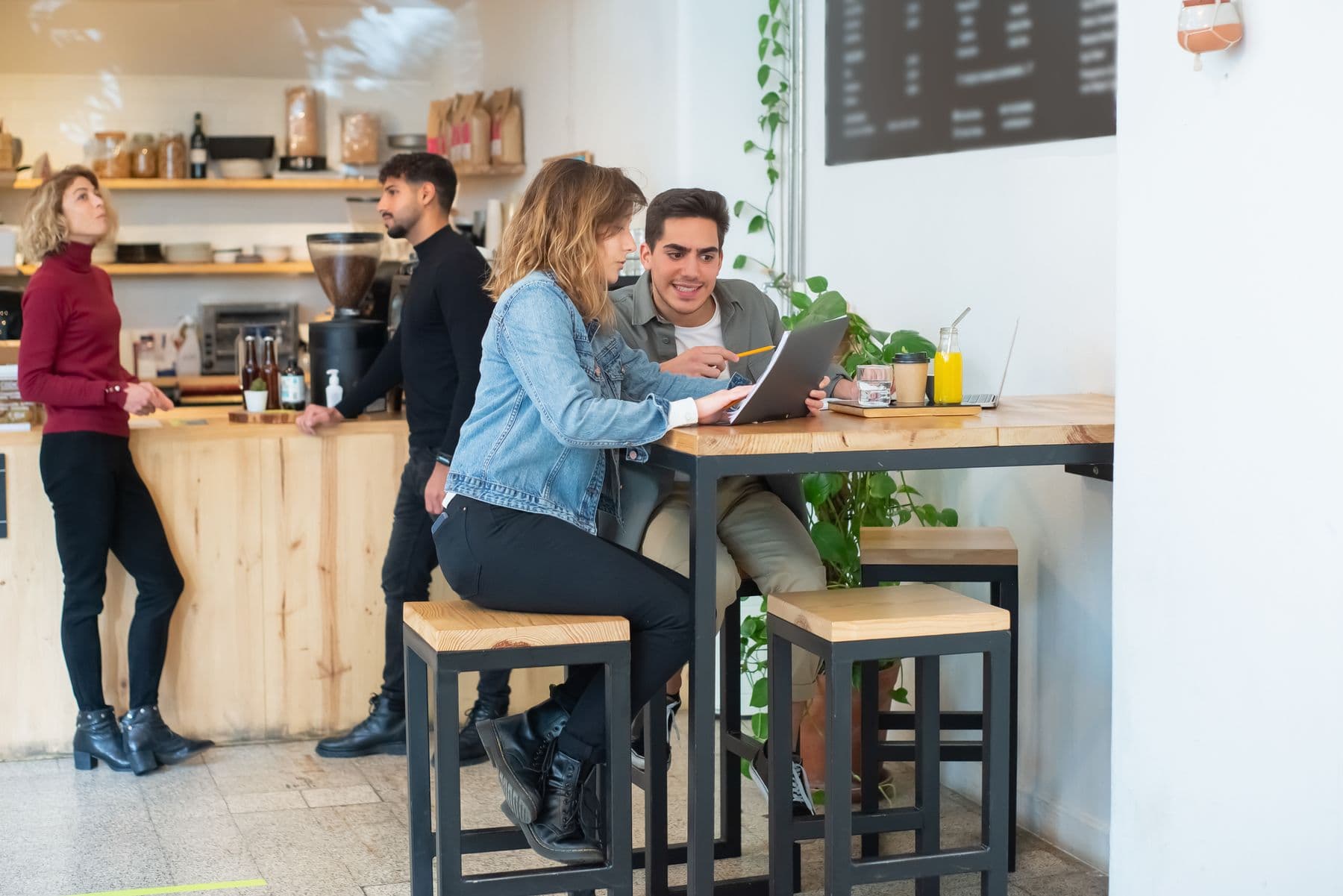 A laptop and coffee on a cafe table in Portugal