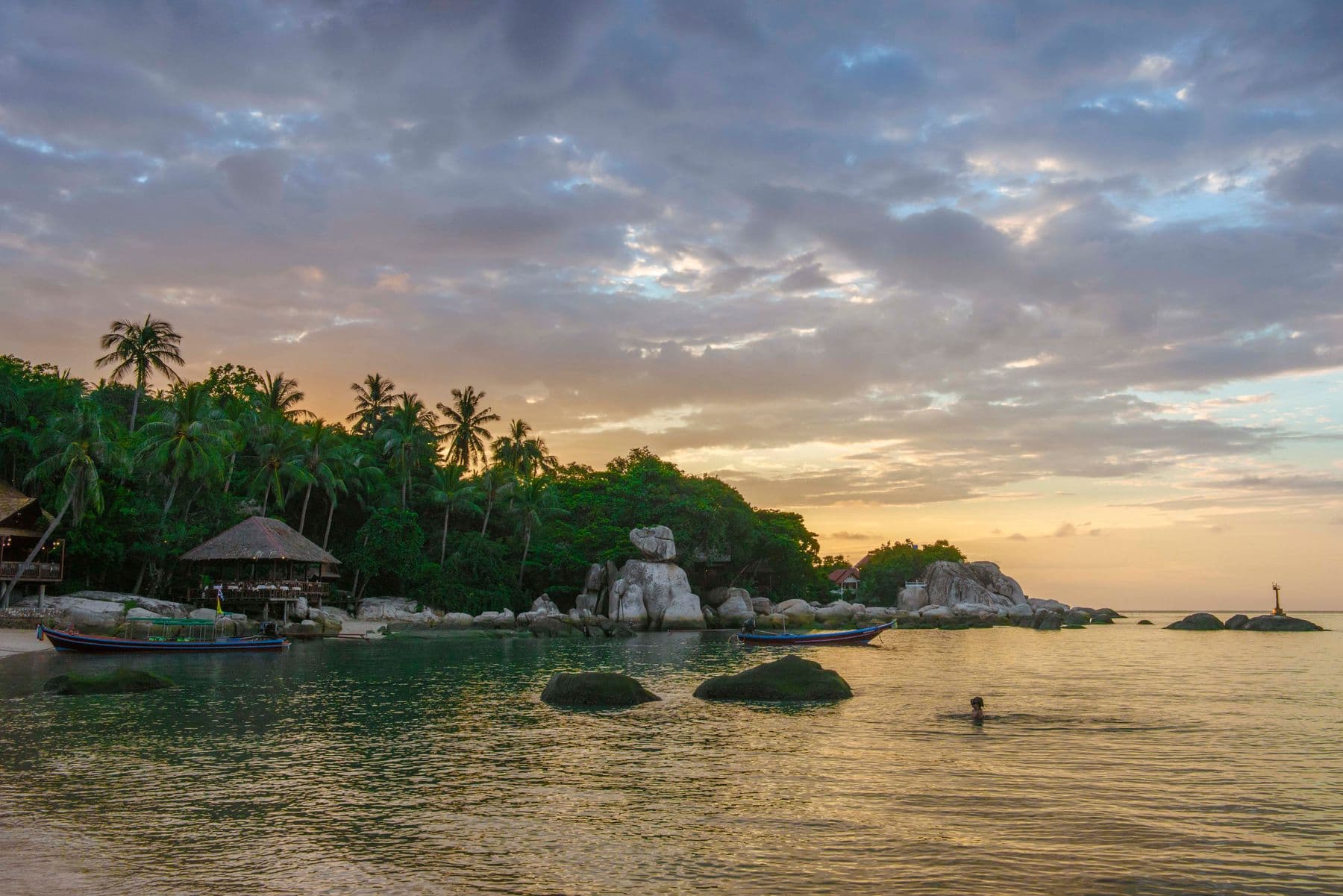 Sunset over coastal rocks on Koh Tao